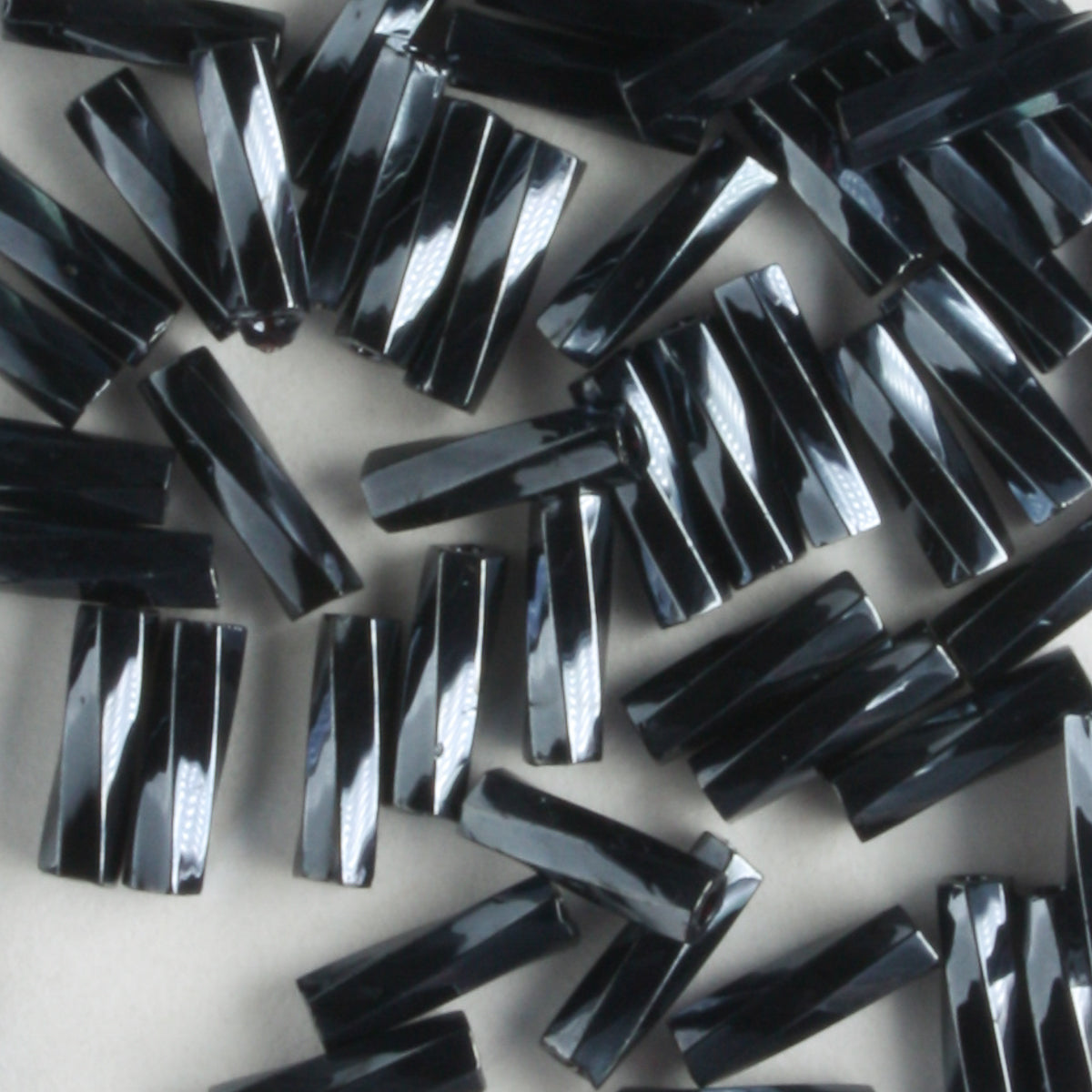 6mm Twisted Bugle Opaque Gunmetal - 7 grams